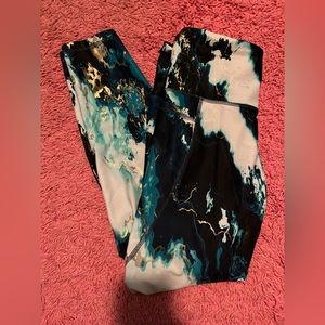 Blue, teal, white, and gold marble workout leggings. Size Medium